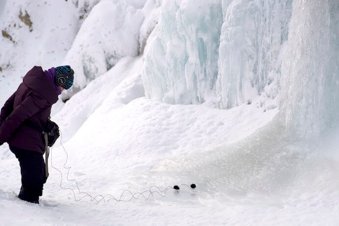 Sound artist Karen Power recording a frozen waterfall--Photo by John Godfrey