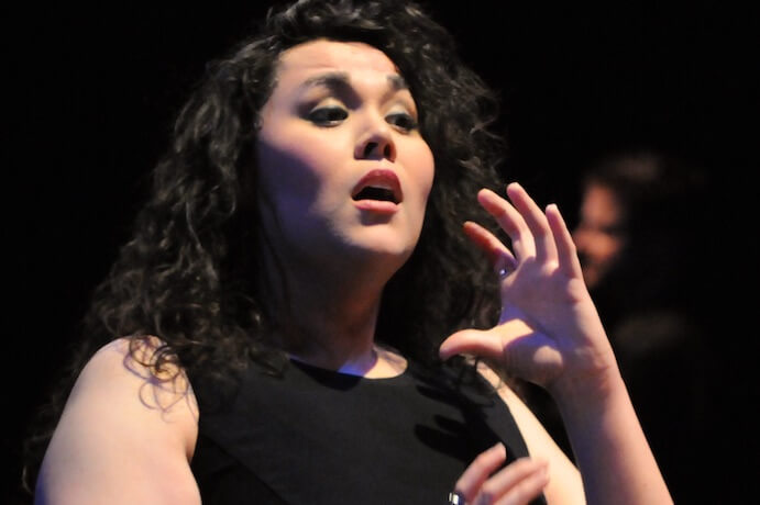 Mari Esabel Valverde conducts the Seattle Men's Chorus in a performance of her work "Crossing"--Photo by John Pai