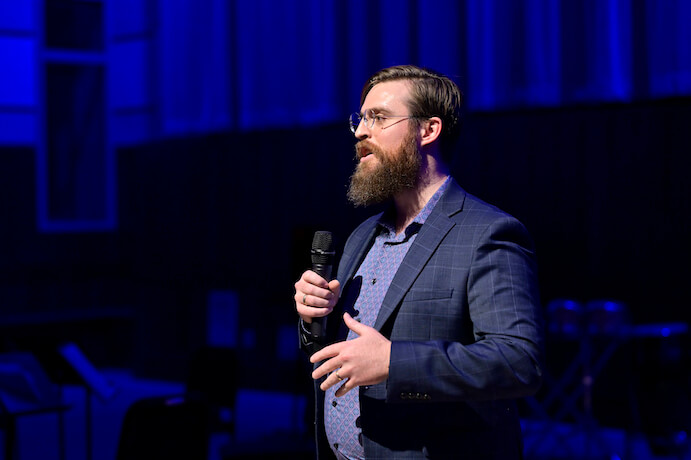 Nick DiBerardino speaking to the audience at the October 2, 2022 performance by Curtis’s Ensemble 20/21 in Gould Rehearsal Hall -- Photo by David DeBalko