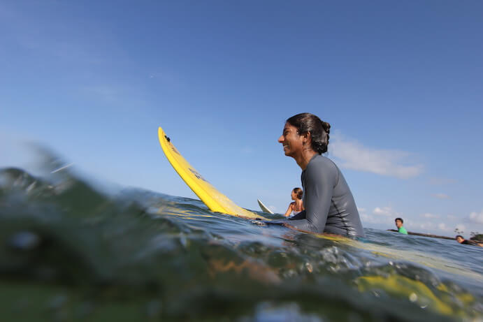 Juhi Bansal surfing -- Photo courtesy of the artist